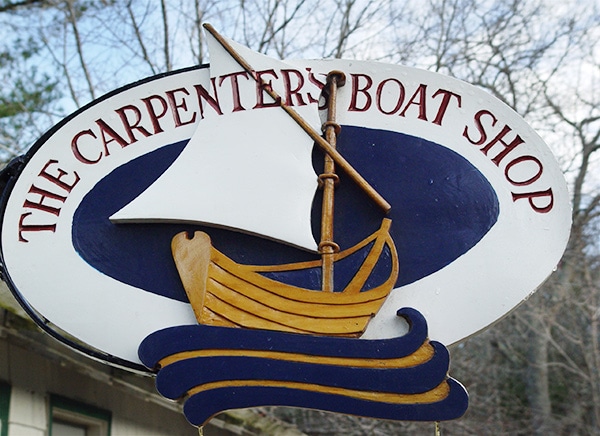 hand-carved boat shop sign
